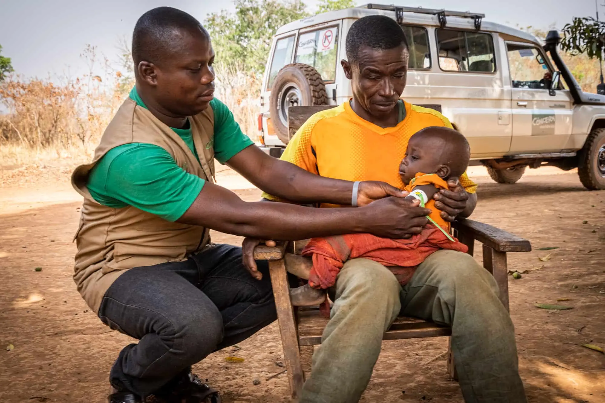 A community health worker cares for a baby.