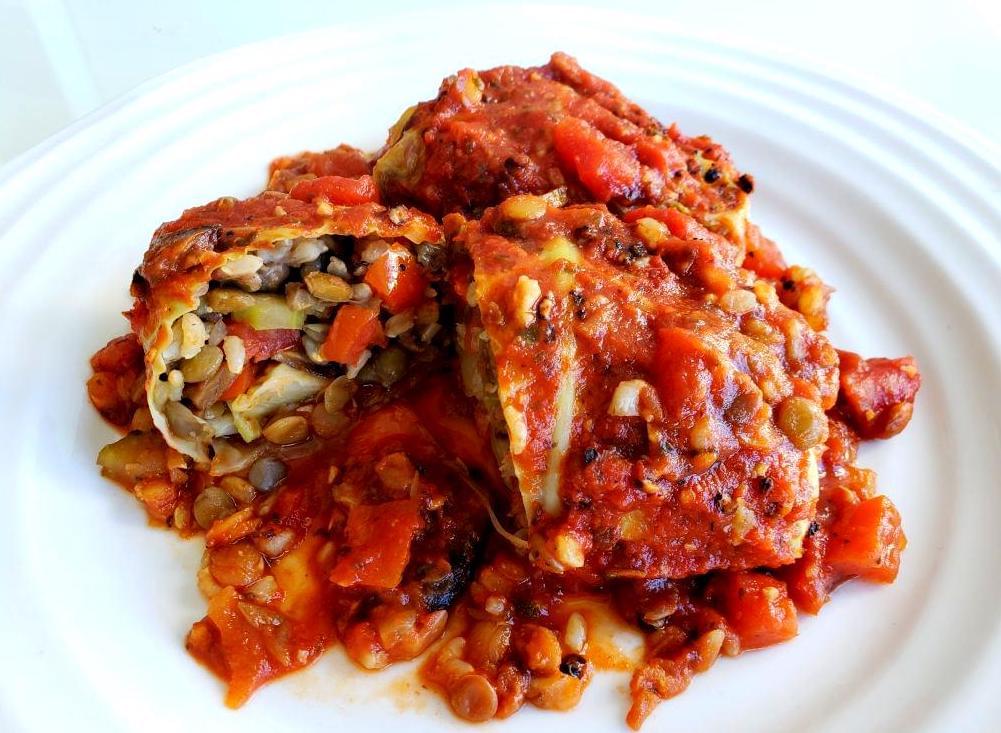 Plate with cabbage rolls stuffed with lentils, and brown rice