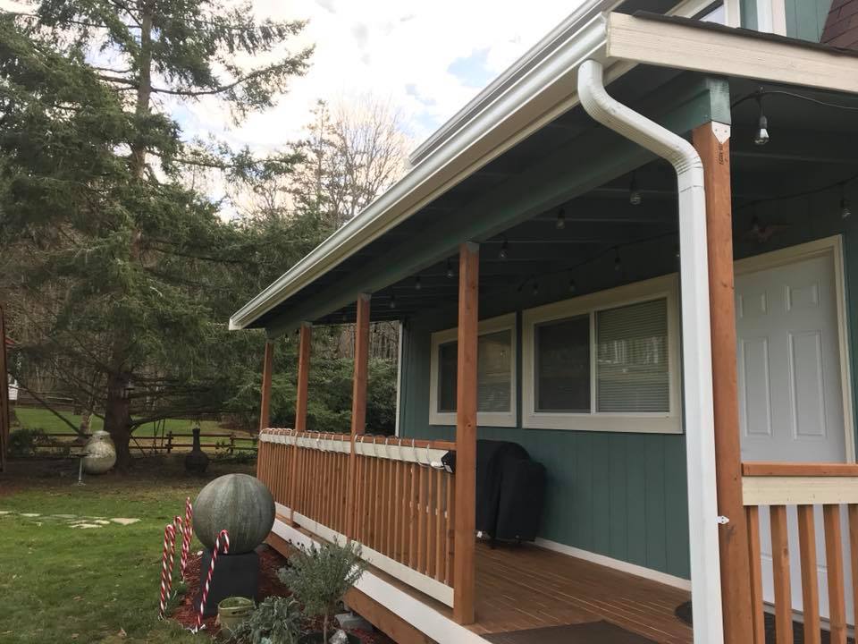 new gutter installtion on green home