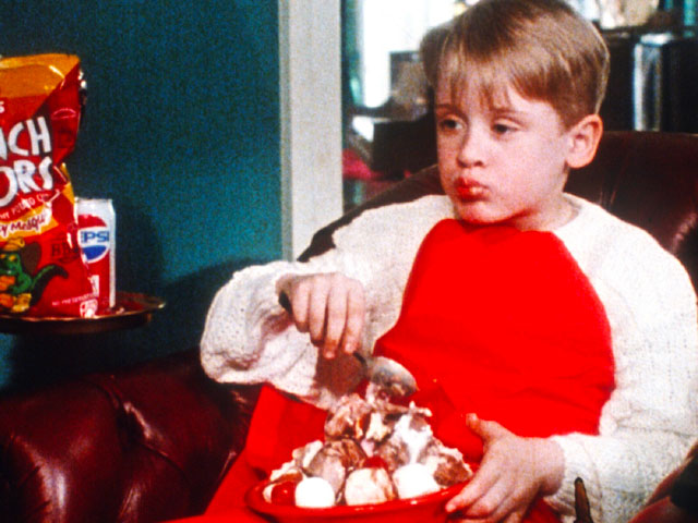 Kevin McCallister consuming junk food while getting ready to play Home Alone Drinking Game
