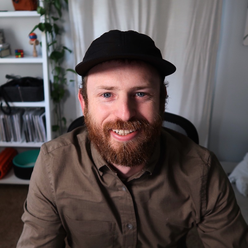 Alex cheesing in his home office