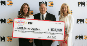 CEO Bob Wills from San Antonio Advertising Agency The PM Group holding donation check to South Texas Charities