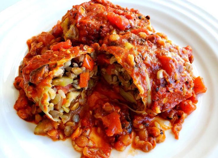 Plate with cabbage roll stuffed with lentils and rice