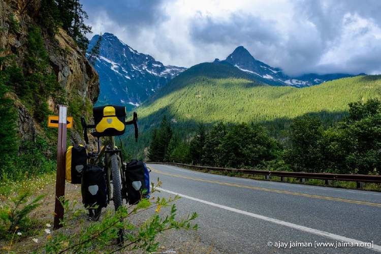 My bike with four panniers and a handle-bar bag somewhere in the Cascade mountains