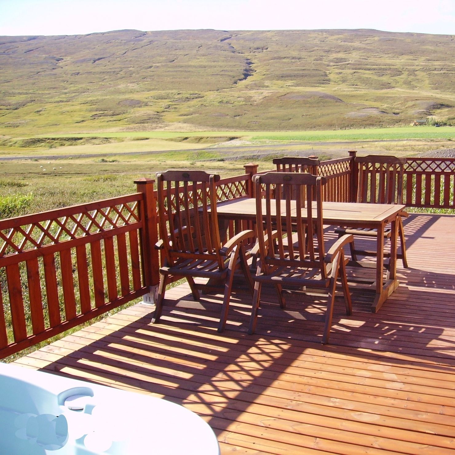 Spacious terrace with garden furniture, hot tub and a view