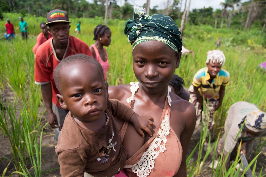 A woman and child at a Concern farmer field school in Liberia