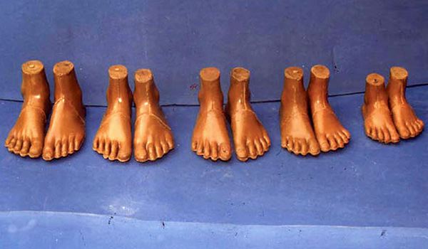 several pairs of jaipur feet in a row
