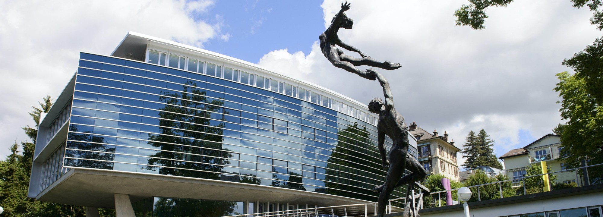 View of a building and statue on the IMD campus