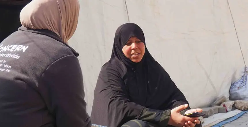Concern staff member with displaced woman in Turkey