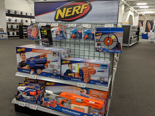 Nerf brand toys stocked on a shelf, including the ELITE Series