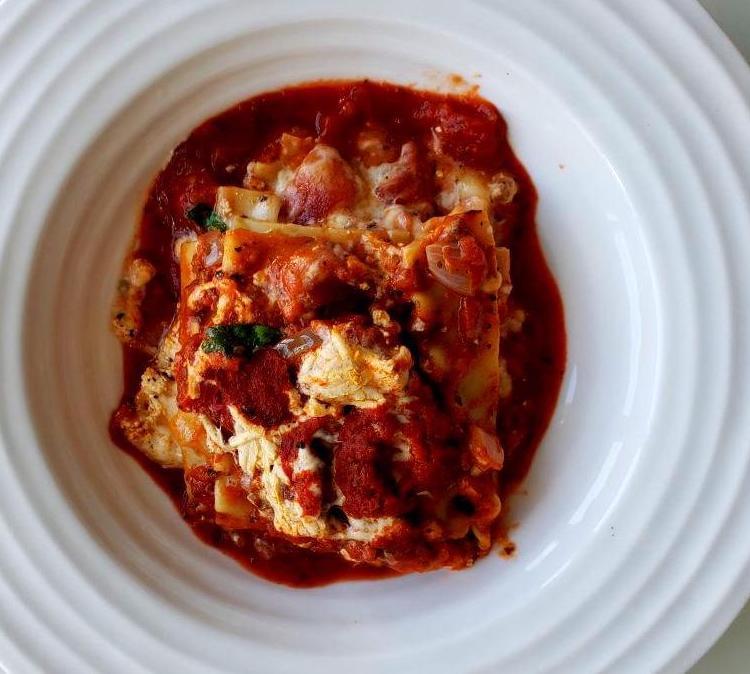 Plate with a square of vegan lasagna
