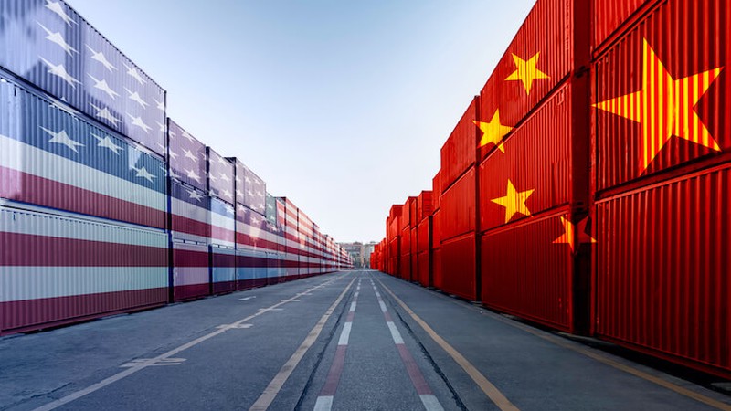 Metaphor image of United States of America and China trade war tariffs as two opposing container cargo and airplane over the port as an economic taxation dispute over import and exports concept