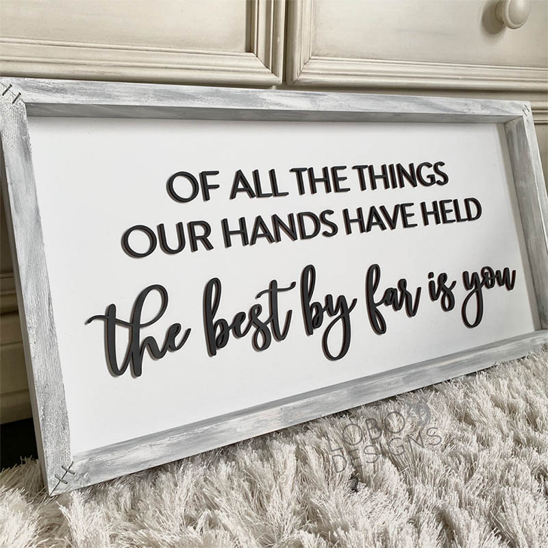 a customer sign that reads, Of all of the things our hands have held, the best by far is you.