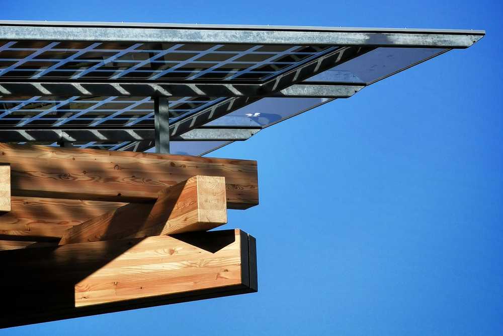 Detail of the K:Port timber structure with photovoltaic panels casting shadows