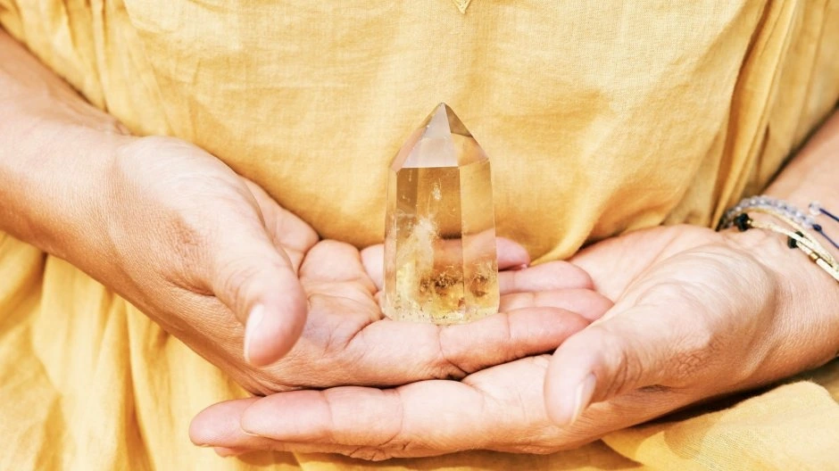 person holding Citrine in hand