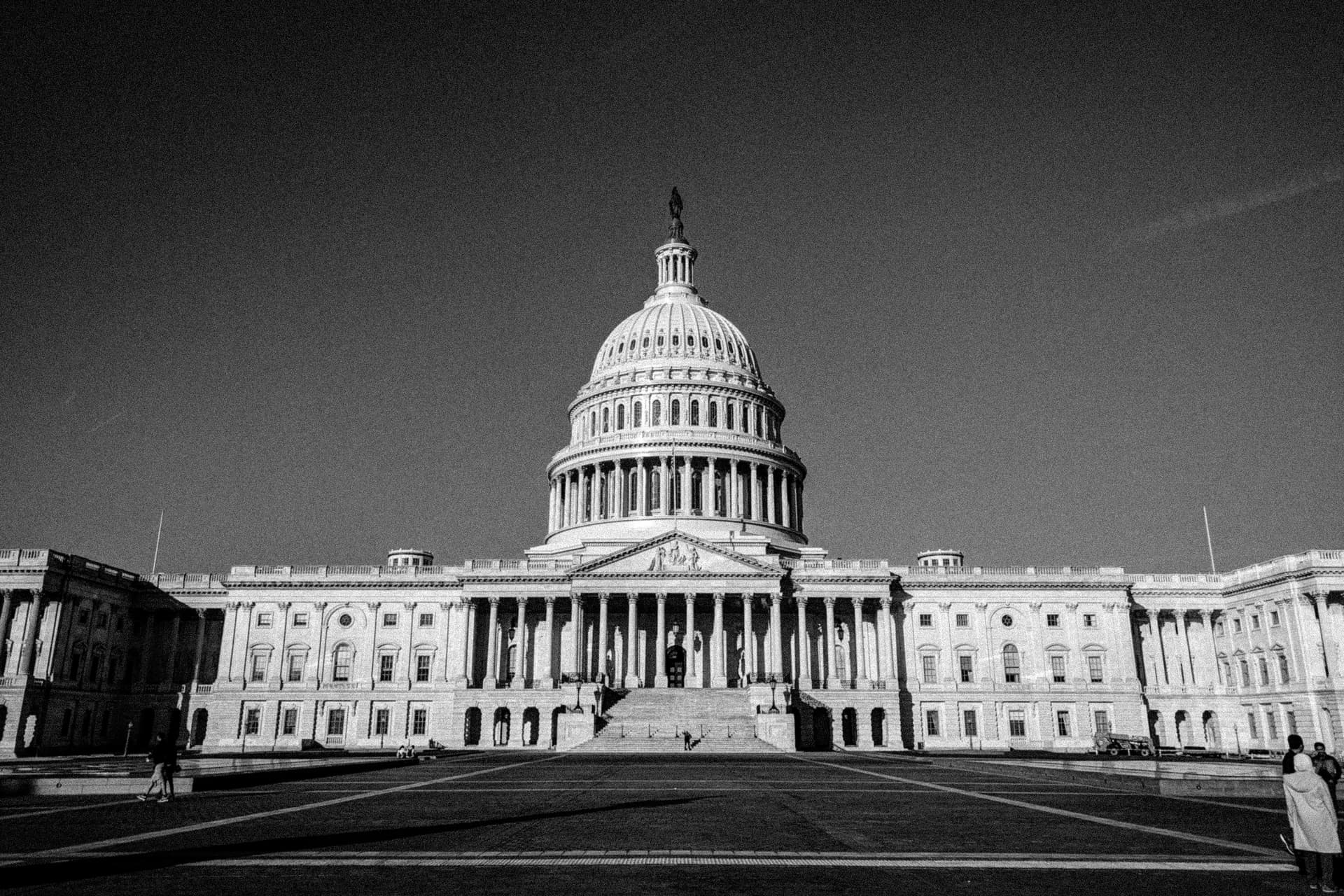A black-and-white photograph of the east side of the US Capitol.