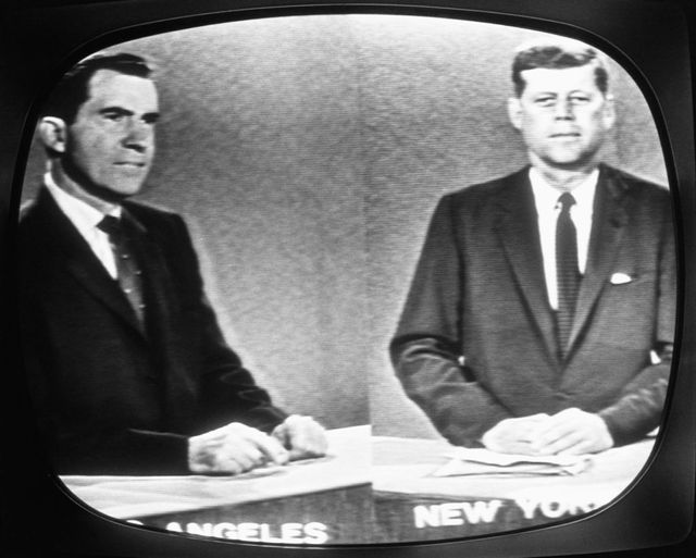 A black and white still
of a television debate
between Richard Nixon and JFK.
