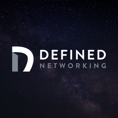 The Defined Networking wordmark over a deep space nebula.