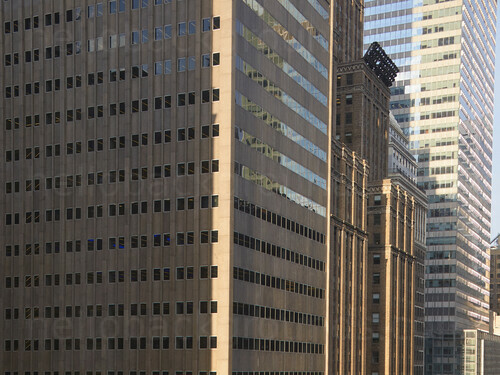 Urban city brown and grey office buildings featuring many windows in shade of unseen neighbouring building Zoom background