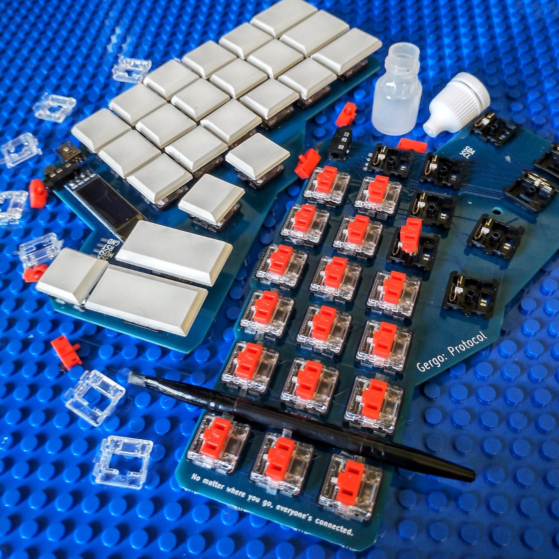 The Gergo keyboard being lubed up with 12g Chocs