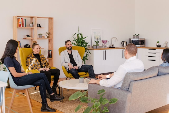 A family counselling session sat in a circle