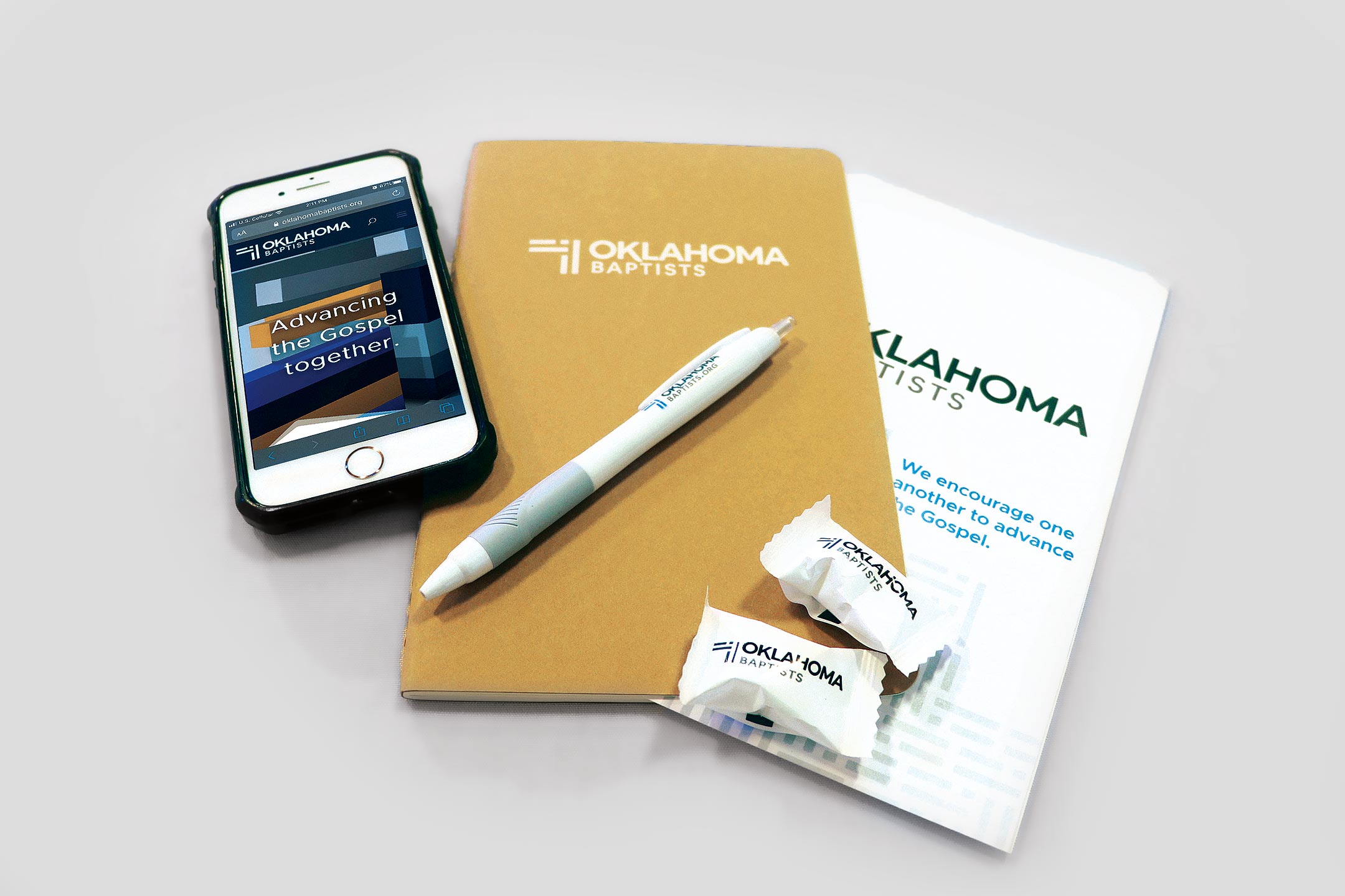A collection of handout items branded out of the Oklahoma Baptists identity system