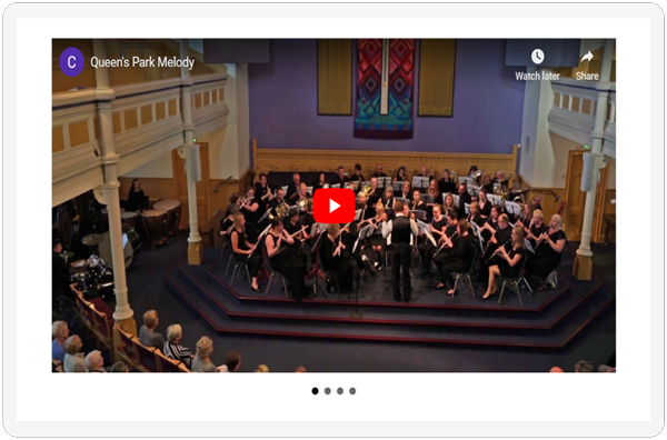 The video slider section of the Aberdeen Concert Band Media Page showcased on a screen