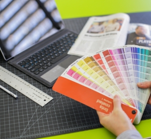 a photo of a designer working with color swatches