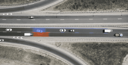 header image showing bird's eye view of cars driving on highway