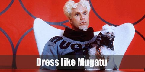 Mugatu wears a gray sweater with black details and his name in bold letters across his chest. He also has on a pair of black pants and black shoes.