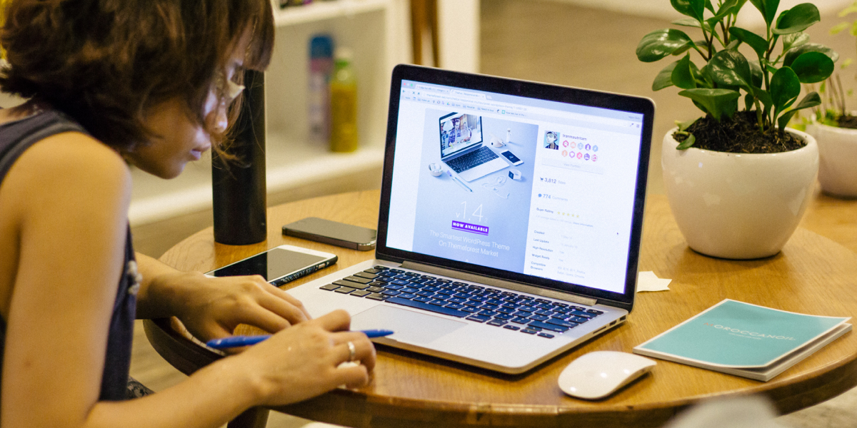 A UX design student creating prototypes online. A UX design student taking an online course.