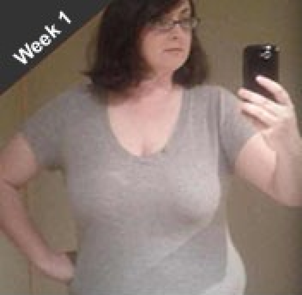 an over weight women taking a photo first first week