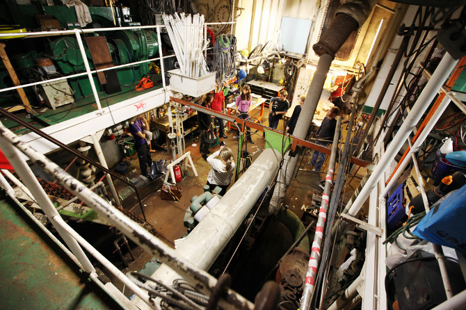 a two-story lab and design studio space held in a barge -- the practice of illutron collective in Denmark