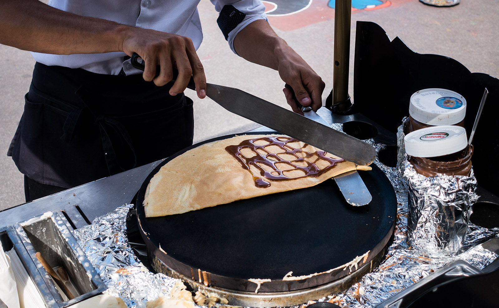 crepe being made on a street cart