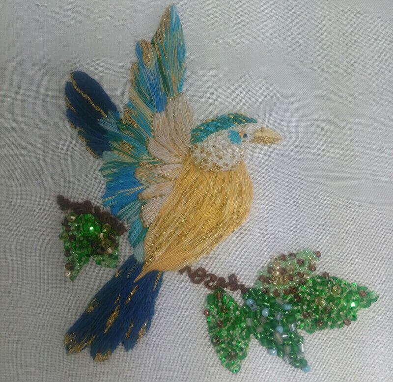 A silk shading kingfisher with beads