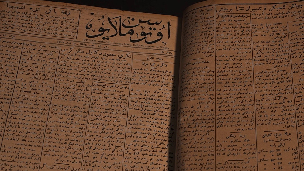 A newspaper spread featuring Utusan Melayu.