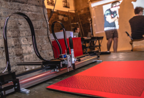 Tim Holman plotter used to create attendee's creative art from the Generative Art workshop