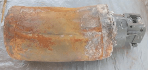 Photo shows an unexploded Sarin grenade laying on a flat surface that appears to be covered in aluminum foil. This photo was taken after the chemical attack in Saraqib, Idlib on 29 April 2013 and was presented as part of an evaluation by the French government in 2017.