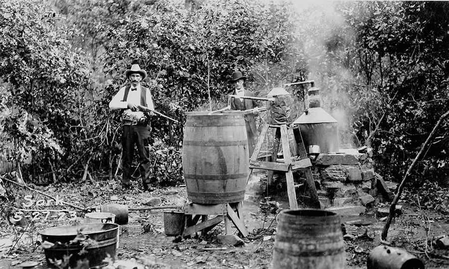 Lawmen seize a moonshine still in Osage County in 1923.