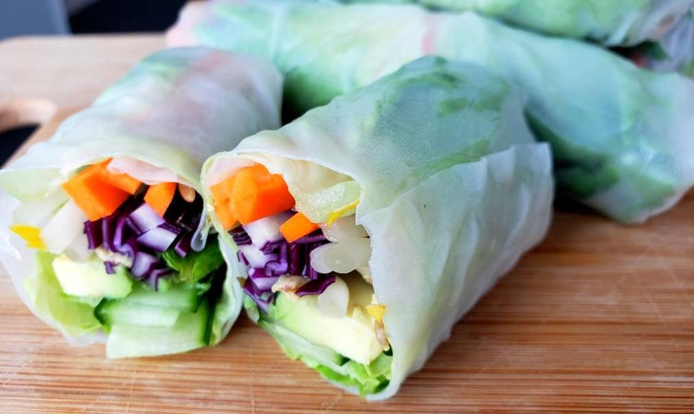 Summer roll stuffed with vegetables cut in half