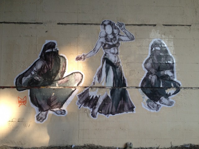 Figure 6. Three female figures on the Tank Wall, by Mozza. Photograph by Bahia Shehab (2013)