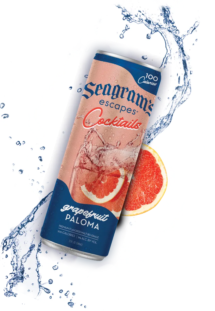 can of Grapefruit Paloma with a splash of cool water and pieces of Grapefruit in the background