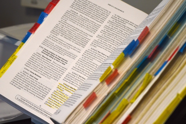 A large book with tabs inserted