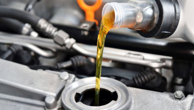 Oil being poured into an engine