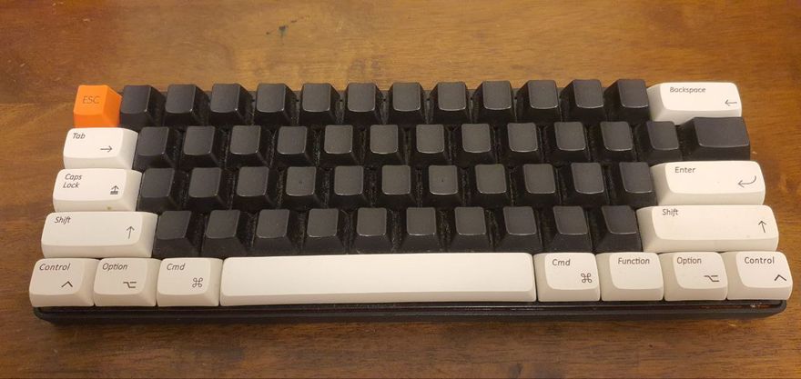 A Vortex Pok3r with mostly blank black keycaps.
