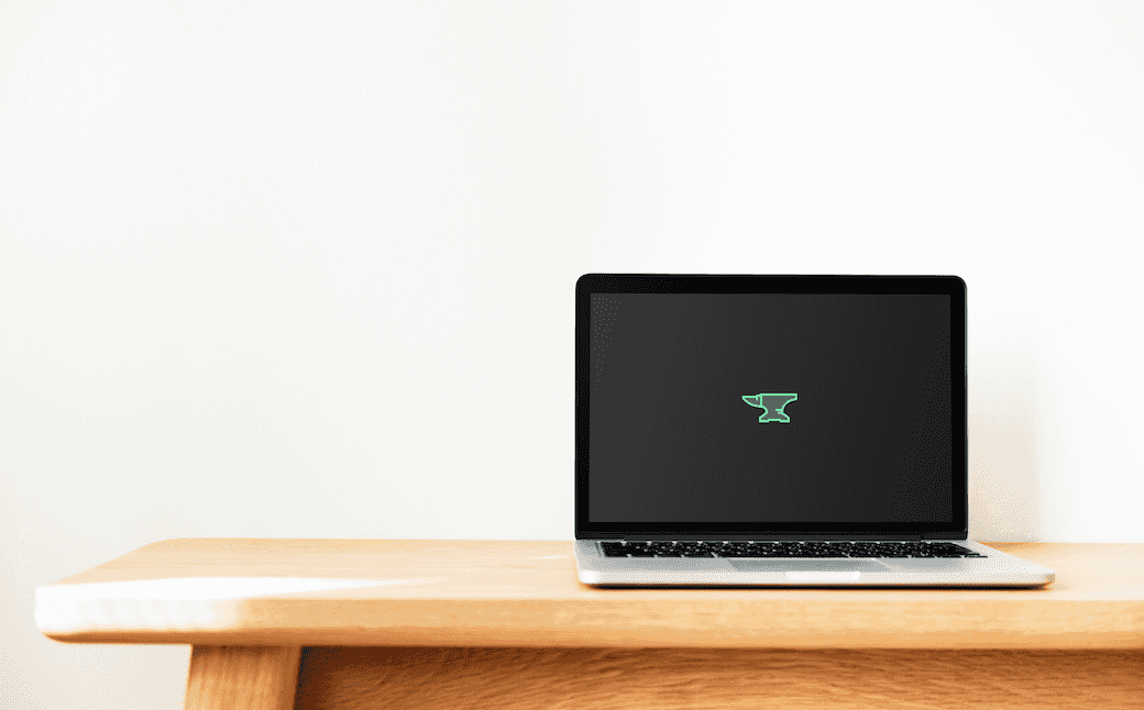 Clean desk, laptop with Anvil logo