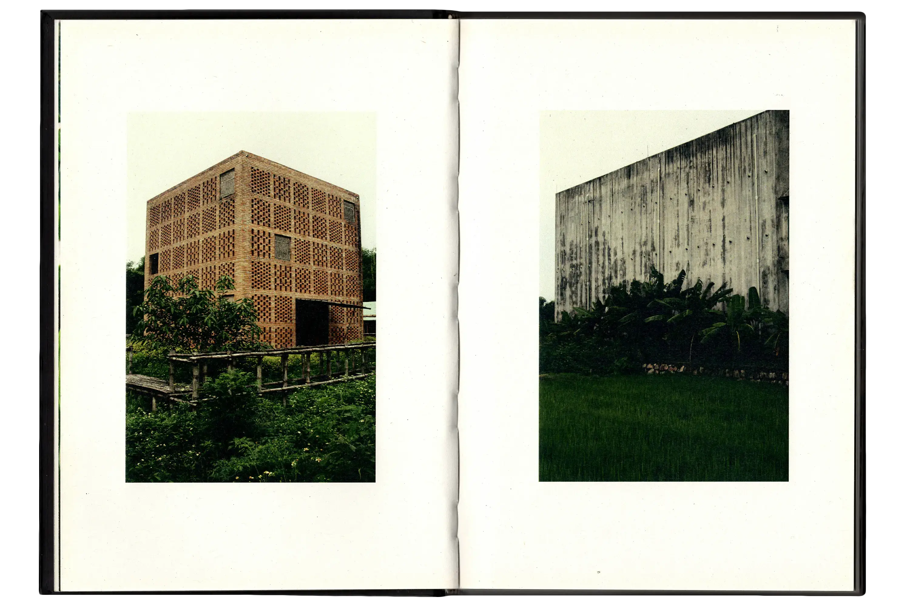 Imperfect Photo Book - left page shows large brick structure set in a forest of trees, right page image shows large concrete structure in forest of trees
