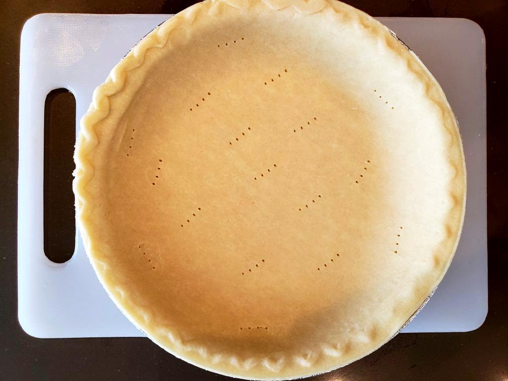 Pie shell with fork pricks in bottom