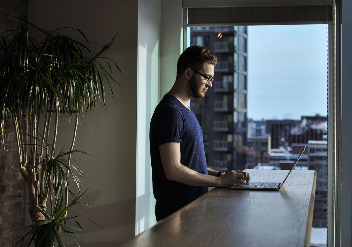 Man working at his home with a laptop