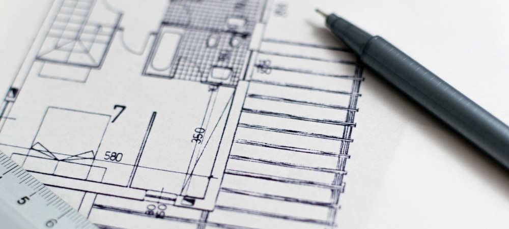 Architecture sketch with a fine pen on top next to a ruler